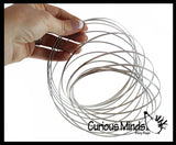 Magic Kinetic Infinity Ring Toy - Flowing Flower Spring Spinning Moving Metal Ring - Fidget Toy That Moves From Arm to Arm Trick