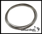 Magic Kinetic Infinity Ring Toy - Flowing Flower Spring Spinning Moving Metal Ring - Fidget Toy That Moves From Arm to Arm Trick