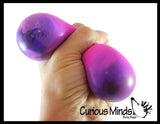 Nee-Doh Color Changing Soft Doh Filled Stretch Ball - Ultra Squishy and Moldable Relaxing Sensory Fidget Stress Toy