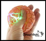 Nee-Doh Magma Volcano - Soft Gel Filled Stress Ball with Mesh Web That Lights Up - Ultra Squishy Light Up Relaxing Sensory Fidget Stress Toy Needoh