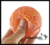 Nee-Doh Magma Volcano - Soft Gel Filled Stress Ball with Mesh Web That Lights Up - Ultra Squishy Light Up Relaxing Sensory Fidget Stress Toy Needoh