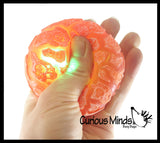 Nee-Doh Magma Volcano - Soft Gel Filled Stress Ball with Mesh Web That Lights Up - Ultra Squishy Light Up Relaxing Sensory Fidget Stress Toy Needoh